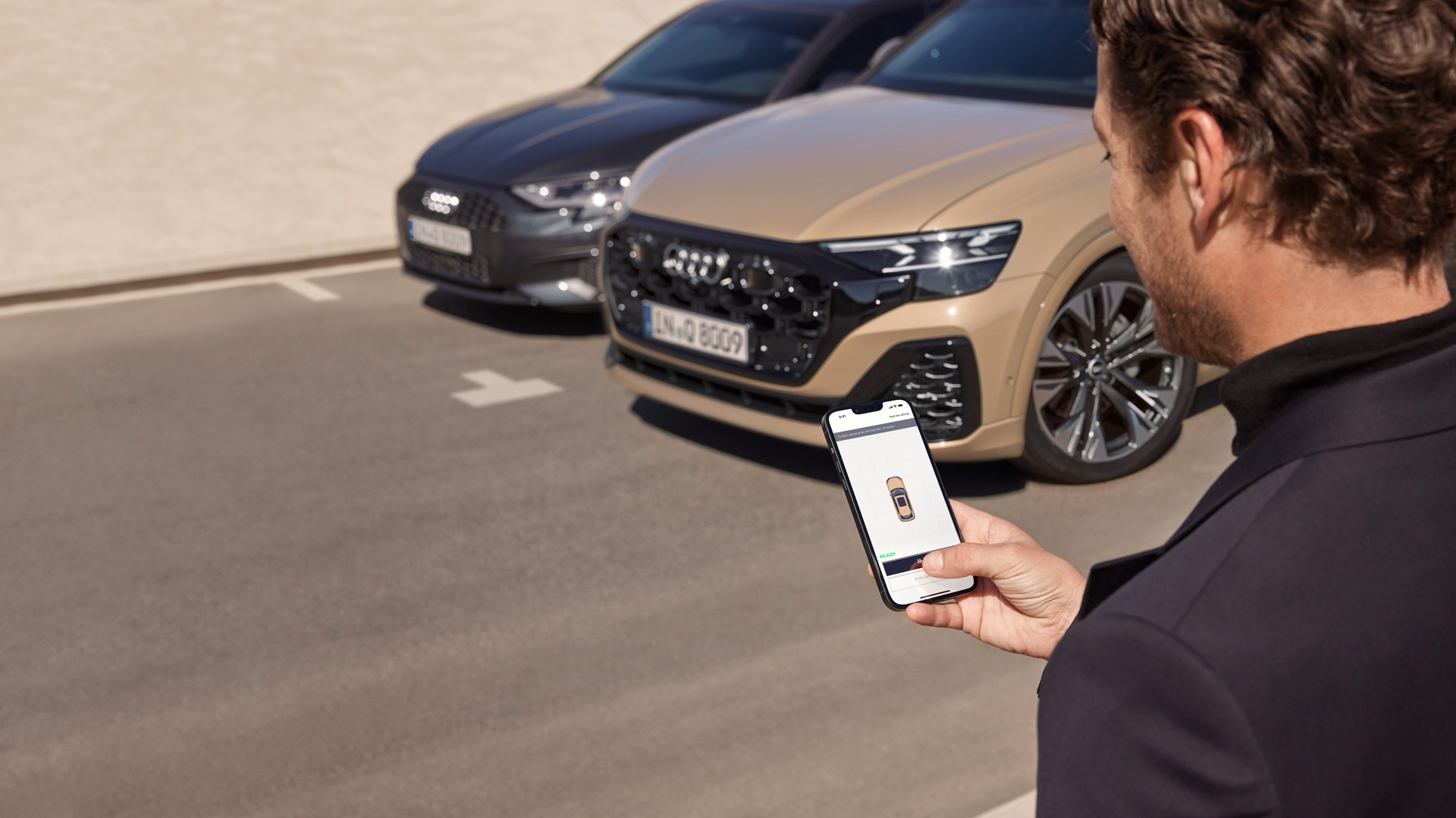 An Audi owner checking their vehicle status on the myAudi app.