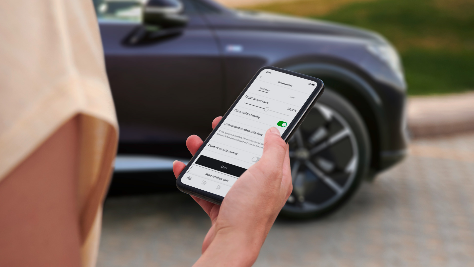 Close-up of an Audi owner adjusting the climatization of her Audi via the myAudi app. 